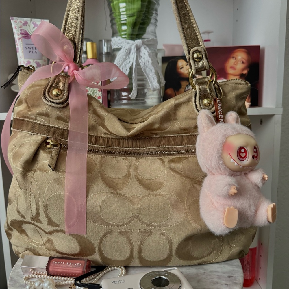 Coach Gold Shoulder Bag with Pink Plush Charm